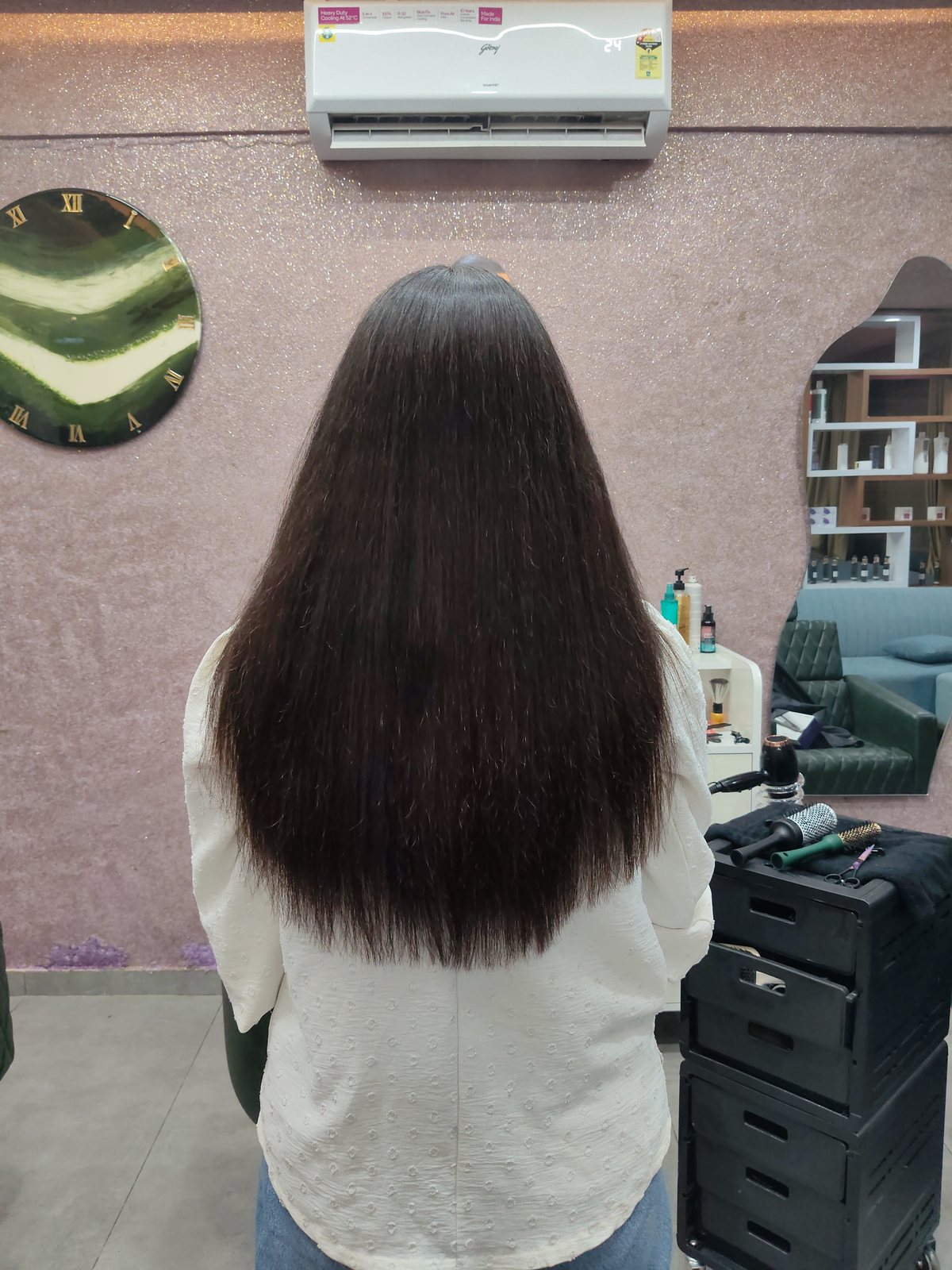 The same guest's hair after Hair Botox, smooth and glossy